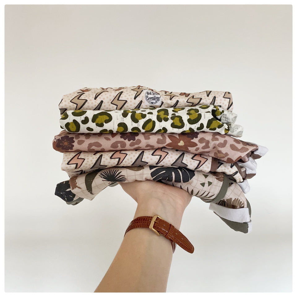 A stack of our British made and printed organic cotton jersey fabrics.