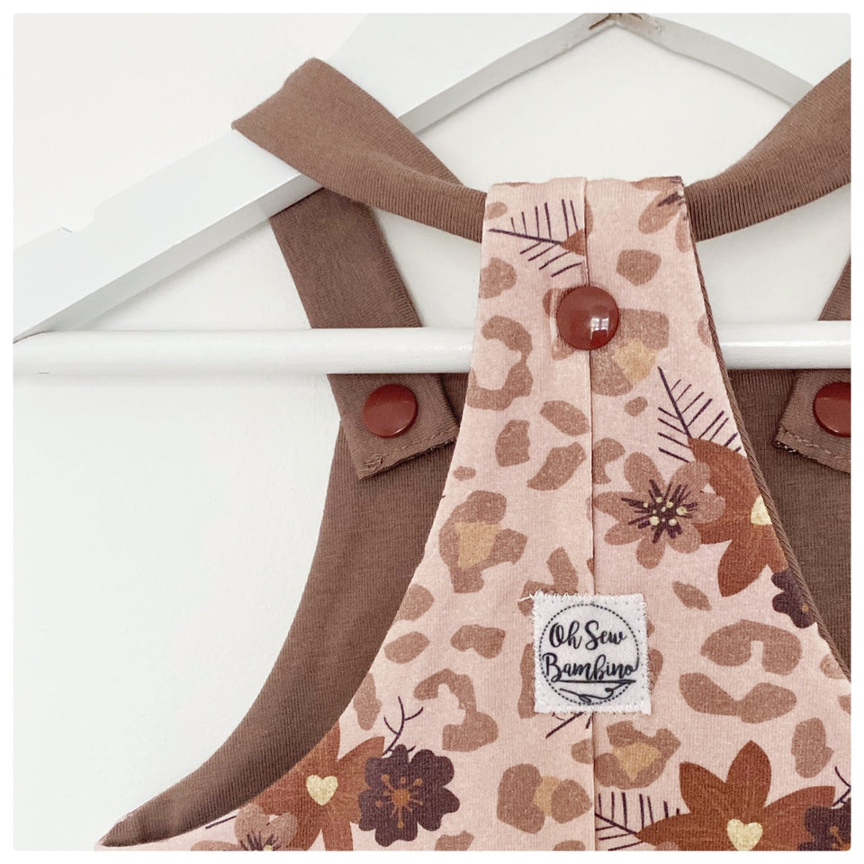 A close up of our signature dungarees shown here in our floral leopard print organic cotton jersey fabric.